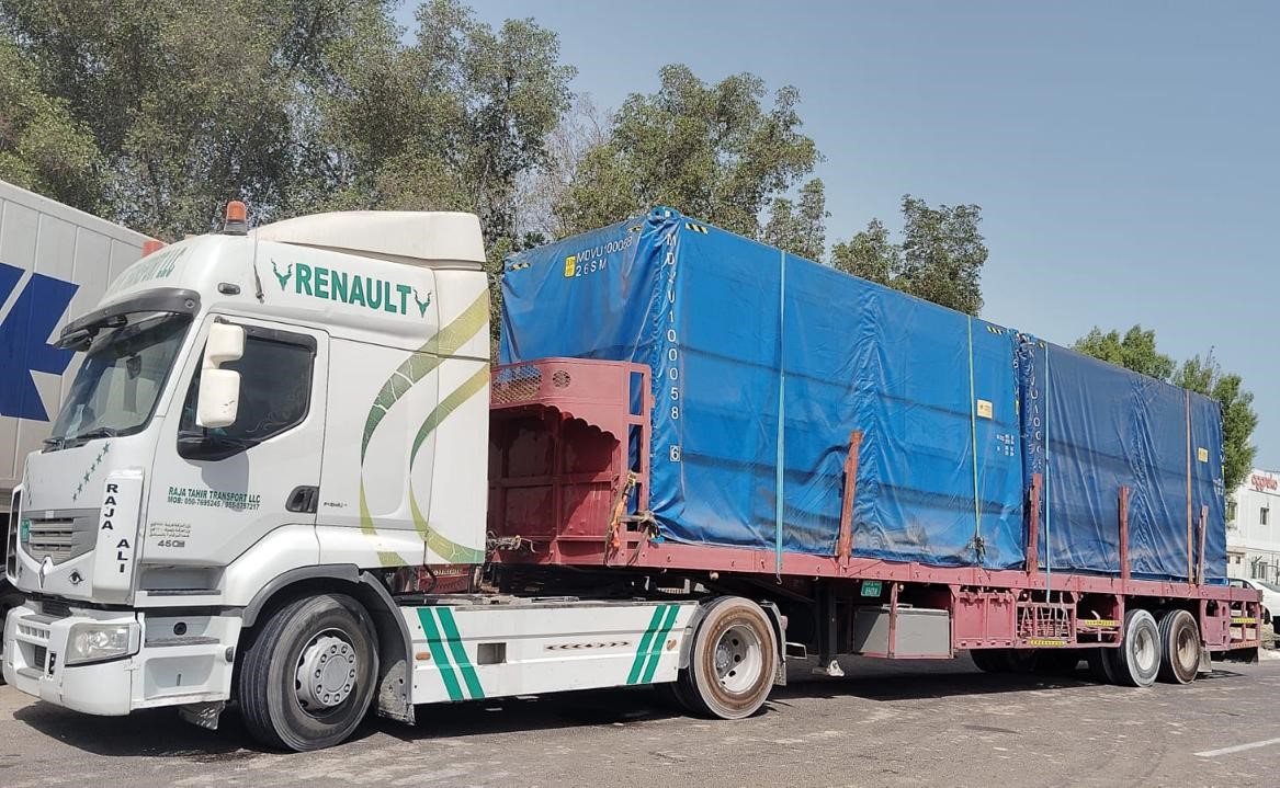 Covered cargo trucks transporting cargo