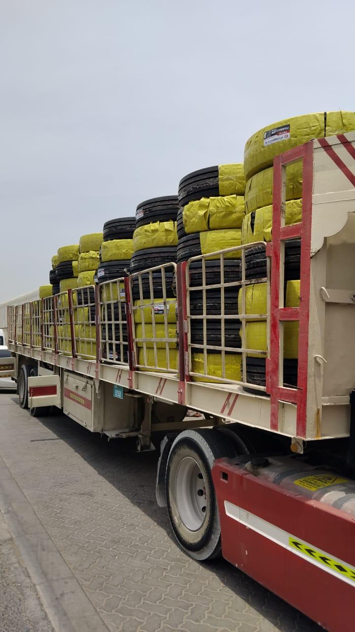 Open-side box trucks transporting cargo