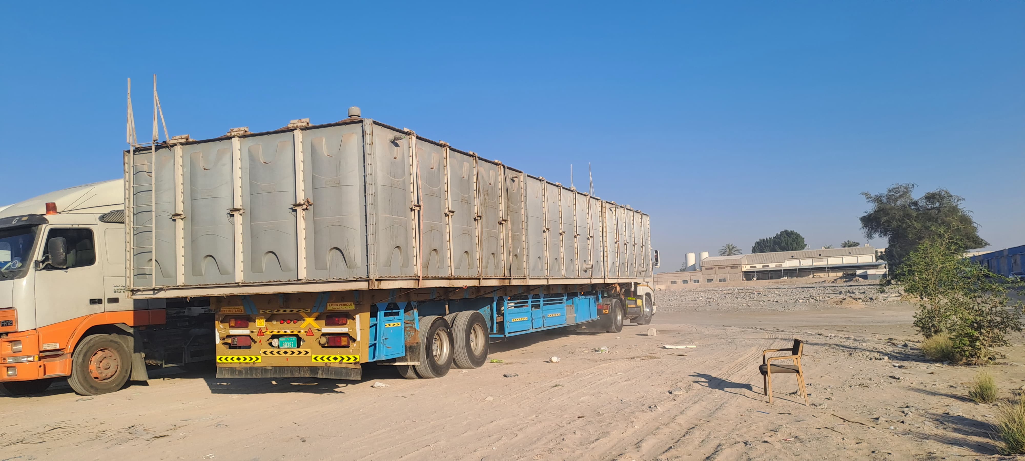 Raja and Tahir trailer transporting prefabricated cabins